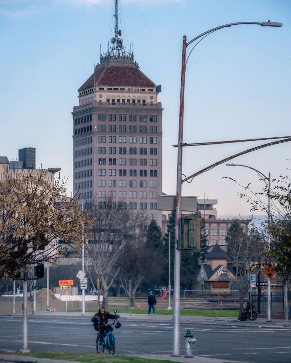 Historic Pacific Southwest Building towering over a street in downtown Fresno, CA