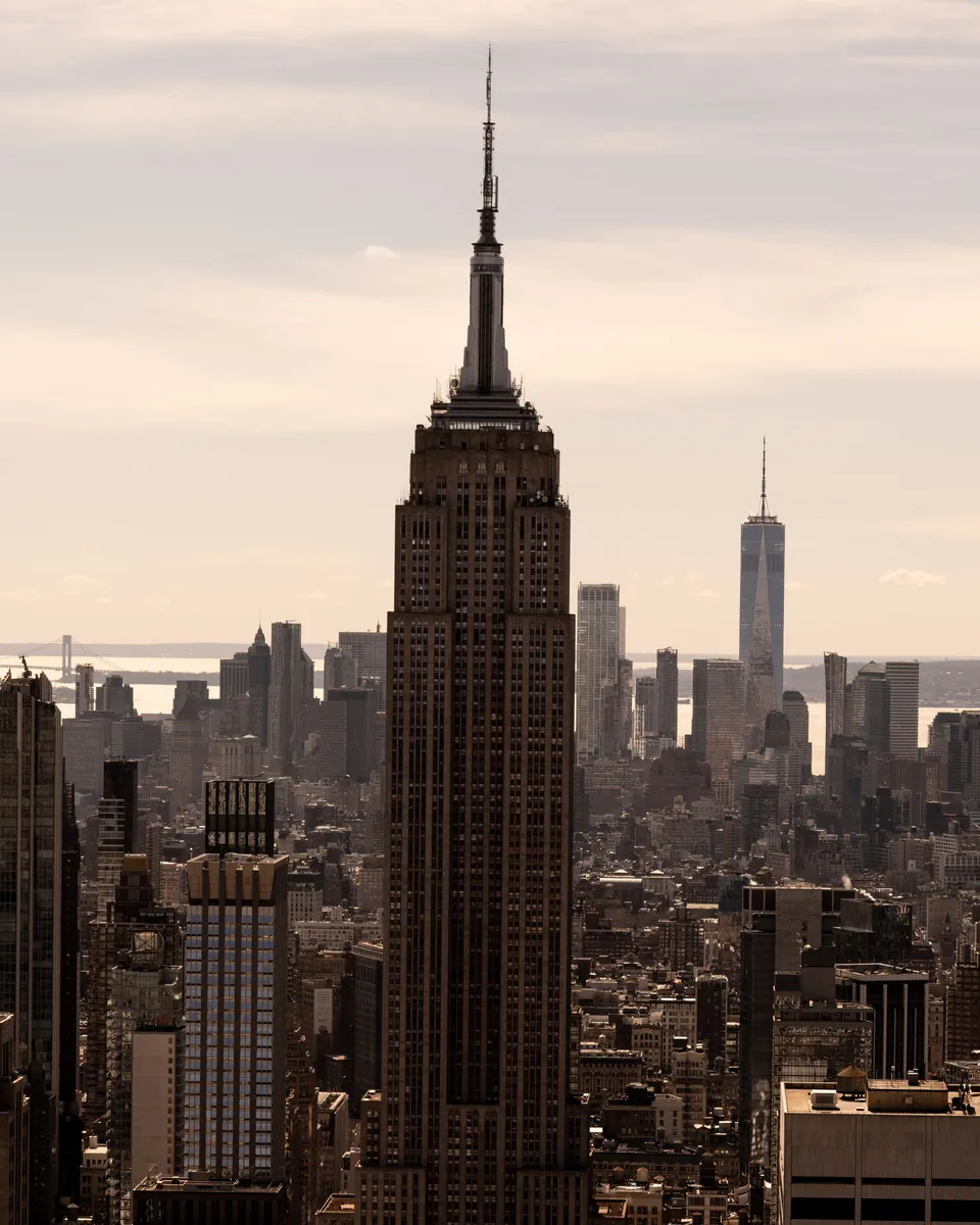 Empire State Building rising above Midtown Manhattan in New York, NY, with Lower Manhattan beyond