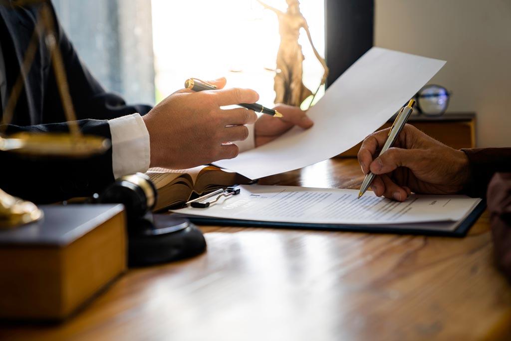 Closeup of tax attorney discussing tax payment plans with client